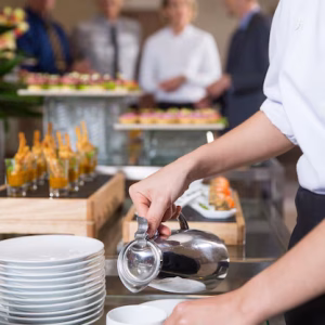 waitress-serving-coffee-buffet-restaurant_1262-2062